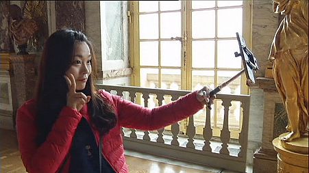 Selfie stick use splits France's cultural capital
