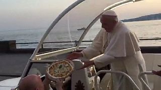Pizza for the Pope as he's handed a drive-by delivery in Naples