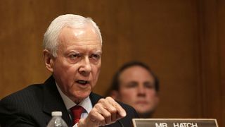Image: Senator Hatch questions witnesses during testimony at the Senate Fin