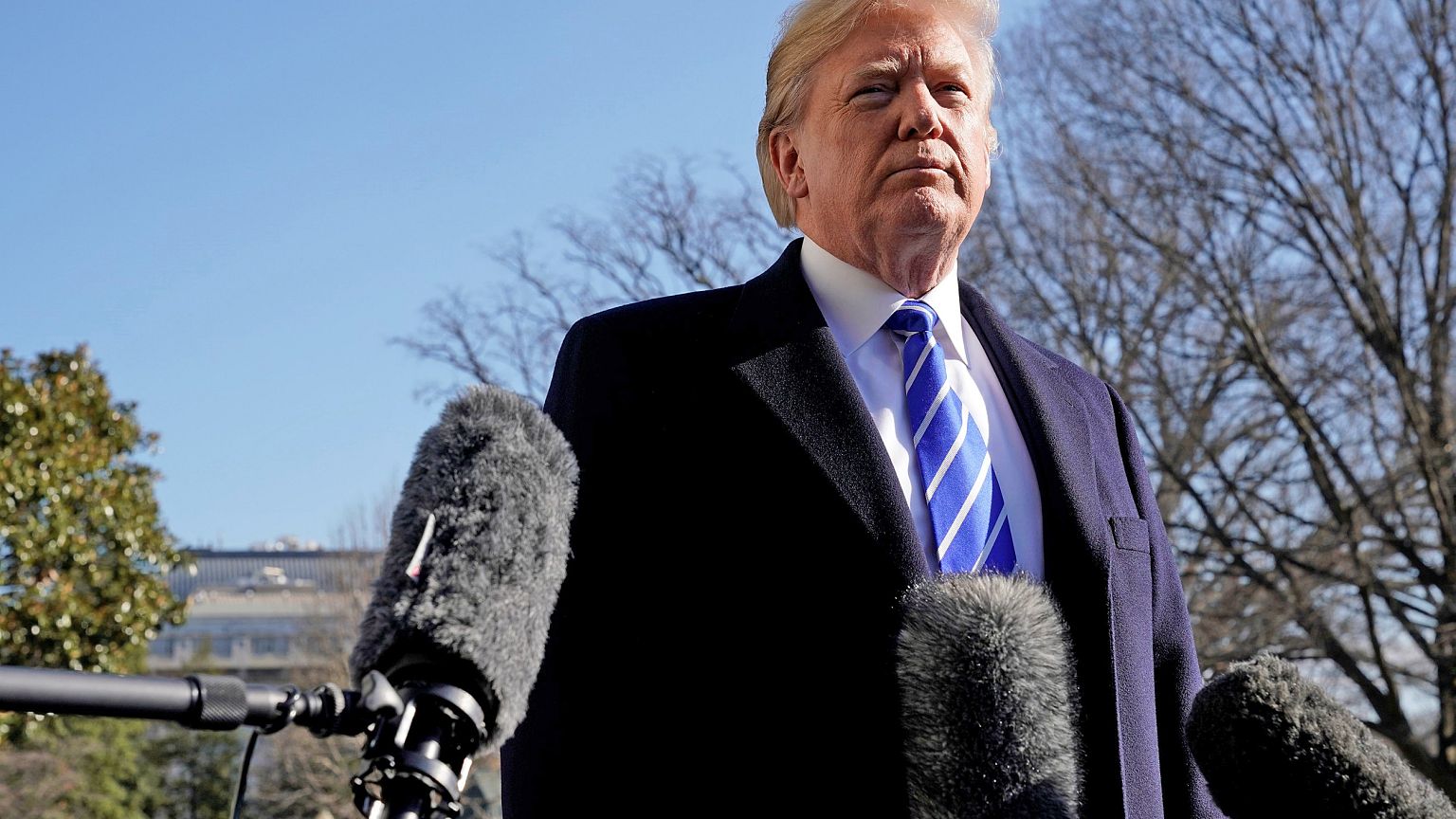 Image: President Donald Trump talks to the media on South Lawn of the White