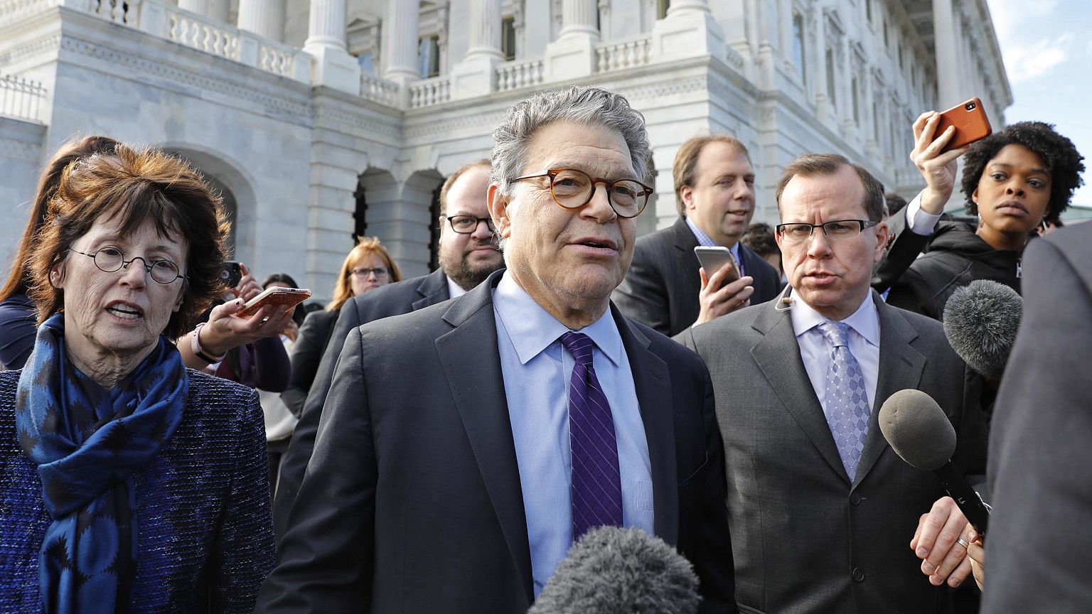 Image: U.S. Senator Franken departs the U.S. Capitol after announcing his r