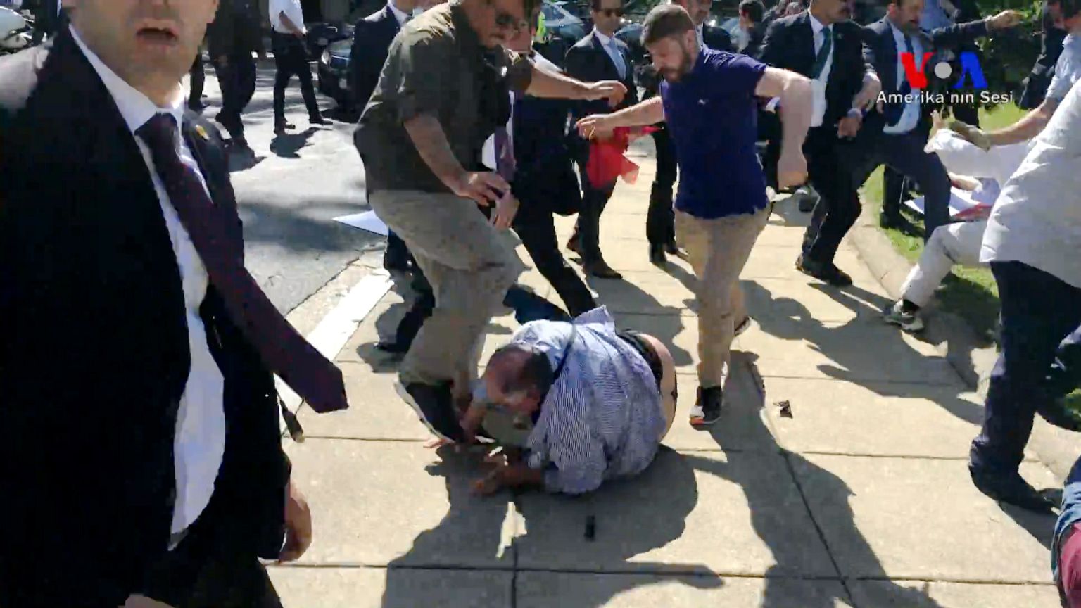 Image: Violent clashes broke out between protesters and supporters of Turke