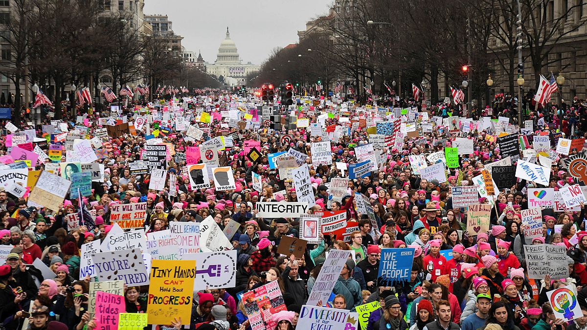 Image: Hundreds of thousands march down Pennsylvania Avenue during the Wome