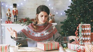 Image: Woman wrapping Christmas gifts