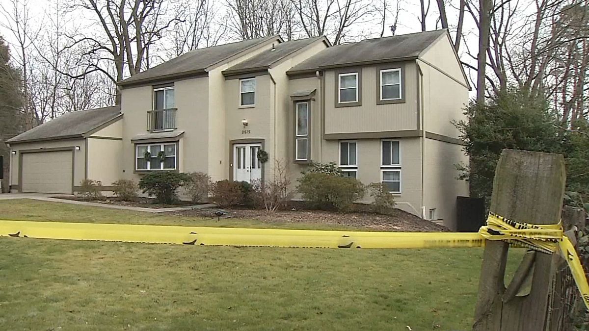 Image: Image: Crime scene tape outside the home of Scott Fricker and his wi