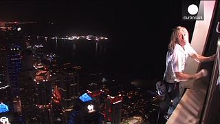 French 'spiderman' reaches new heights scaling world’s tallest twisted building in Dubai