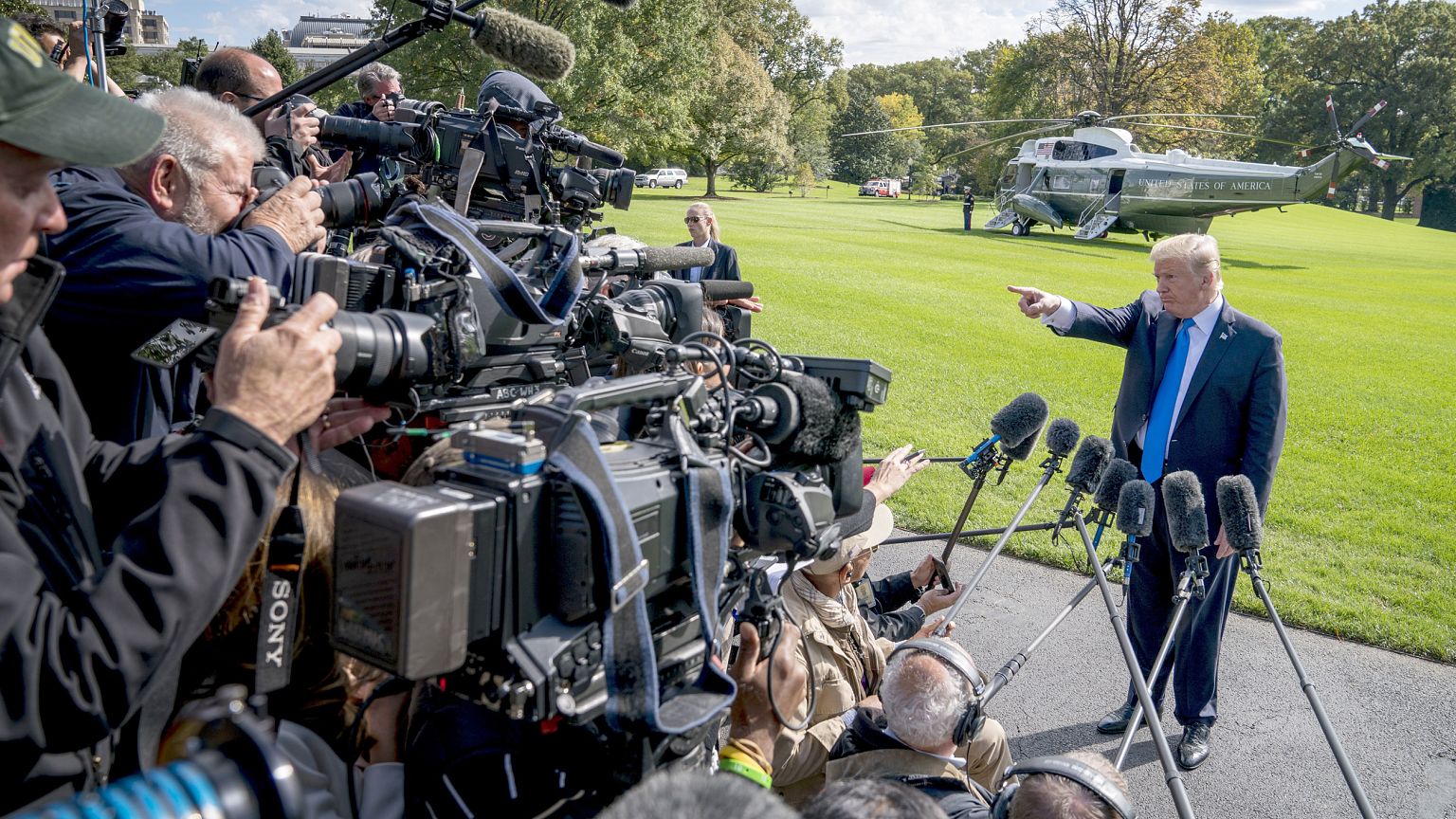 Image: President Donald Trump calls on a reporter before boarding Marine On