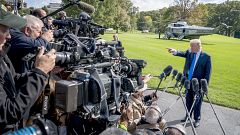 Image: President Donald Trump calls on a reporter before boarding Marine On