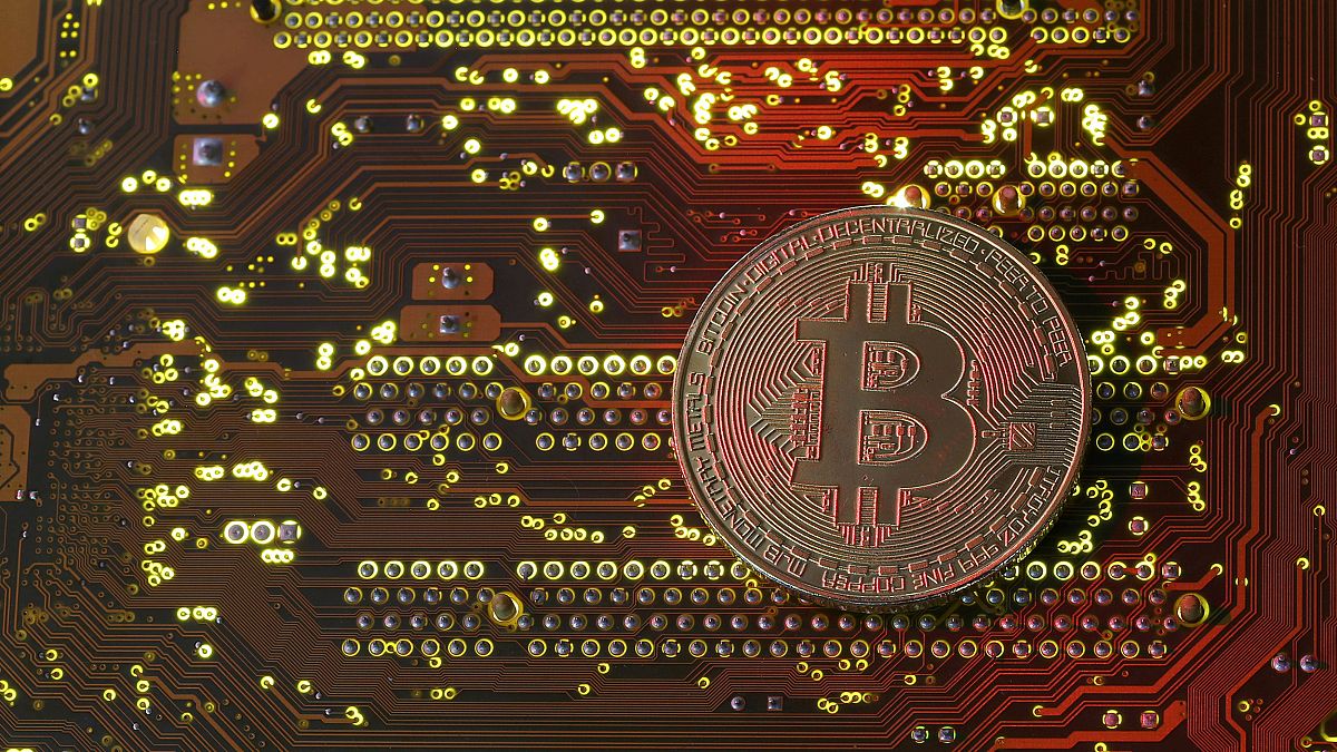 Image: A bitcoin illustration on a motherboard on Oct. 26, 2017.