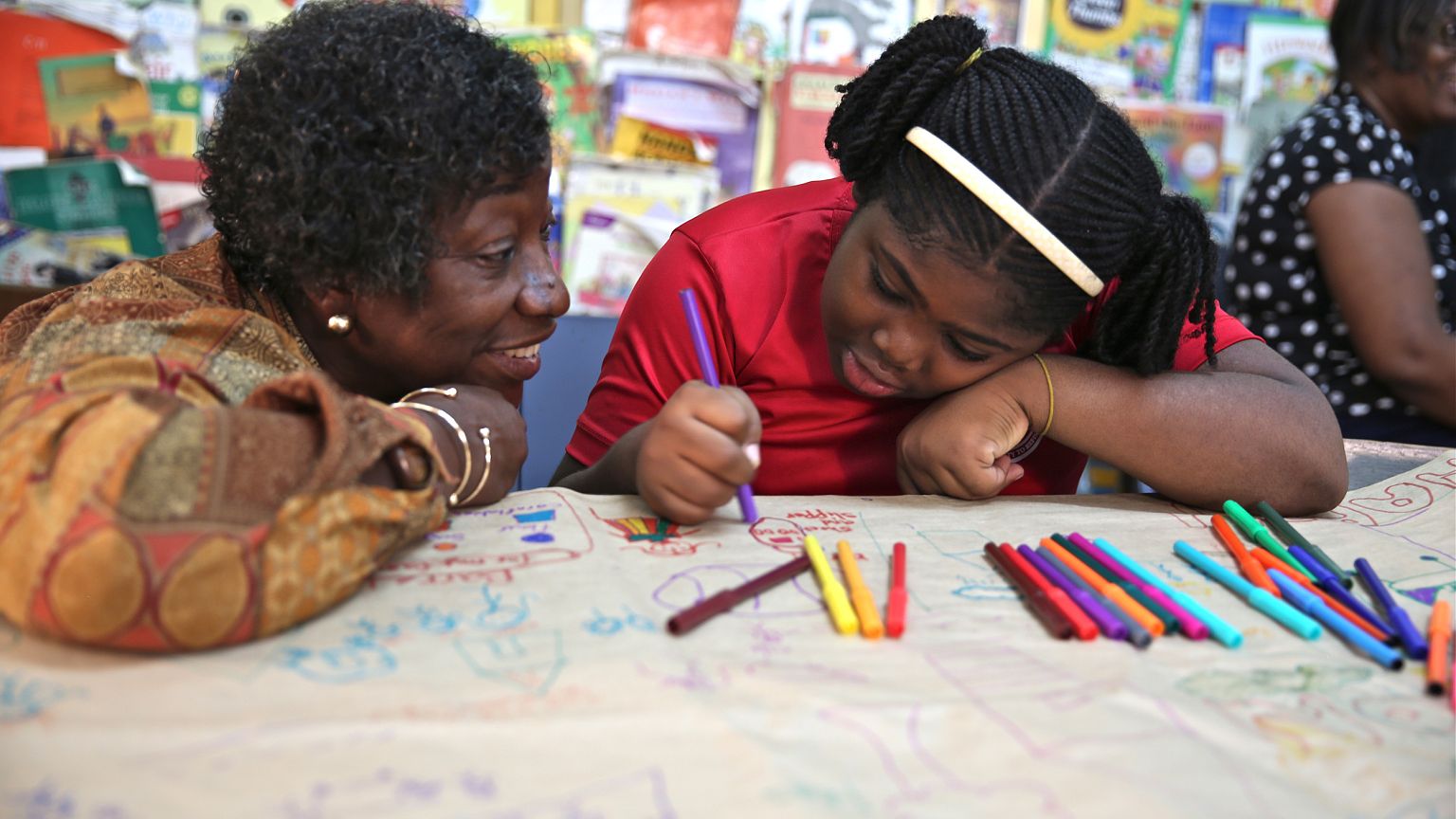 Image: Dr. Claudette Crawford-Brown interacts with Shaniqua Long