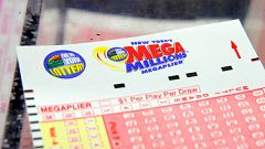 Image: A ticket is seen ahead of the Mega Millions lottery draw which reach