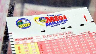 Image: A ticket is seen ahead of the Mega Millions lottery draw which reach