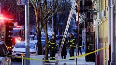 Image: Fire Department of New York (FDNY) personnel work on the scene of an