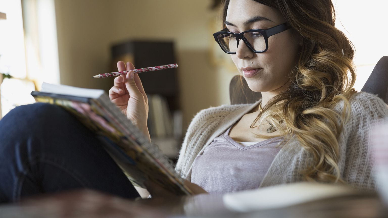 Image: Woman writing in notebook