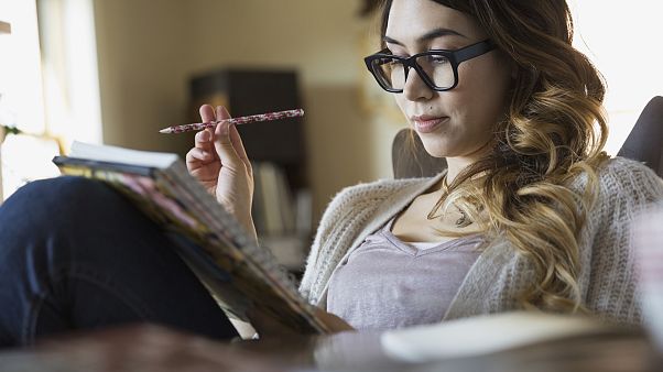 Image: Woman writing in notebook Image: Woman writing in notebook
