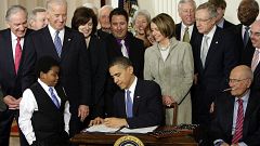 Image: President Barack Obama signs the health care bill in the East Room o