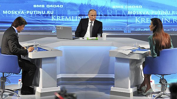 Putin swats down Russian worries on annual televised call-in Putin swats down Russian worries on annual televised call-in