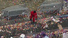 Image: A member of the cleanup crew sweeps confetti in New York's Times Squ