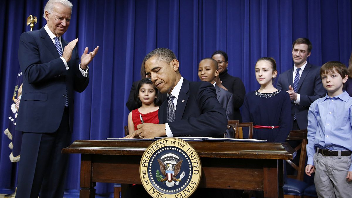 Image: President Barack Obama signs executive orders on gun violence