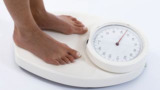 Image: Creative Image of Woman on Weight Scale