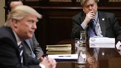Image: White House Chief Strategist Steve Bannon, right, listens as Preside