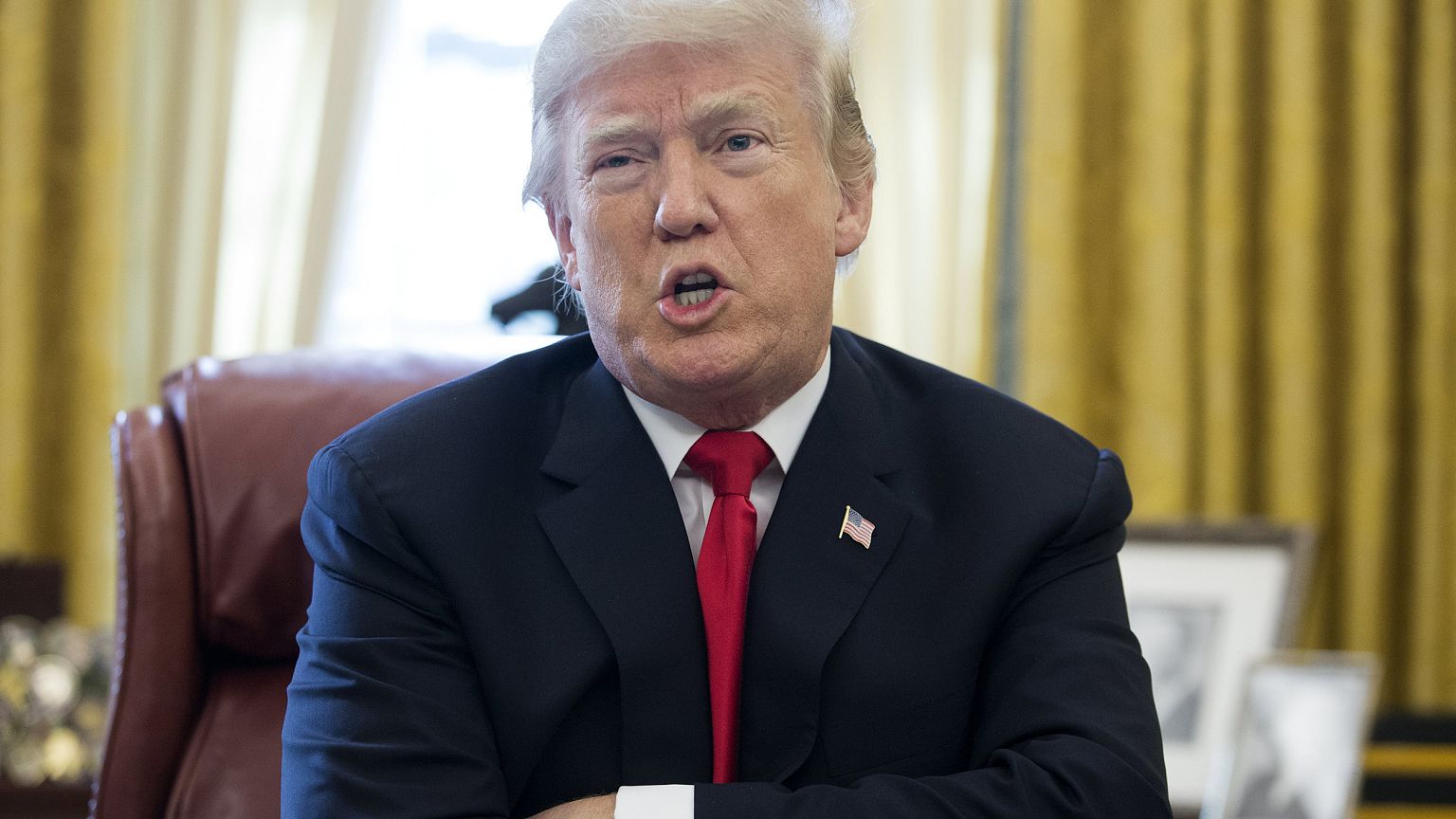 Image: President Donald Trump speaks to members of the media