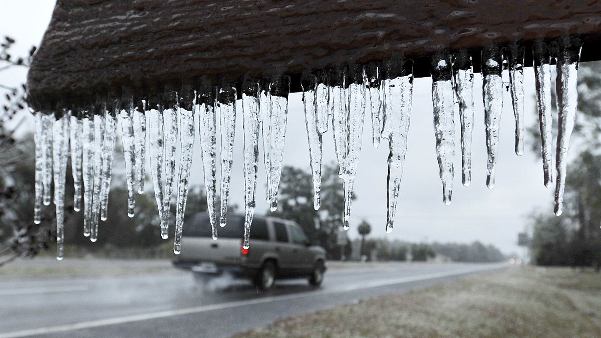 Image: Icicles hang from a sign in Hilliard, Florida