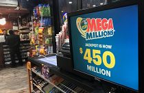 Image: A Mega Millions sign is pictured in a store in New York City