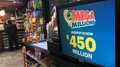 Image: A Mega Millions sign is pictured in a store in New York City