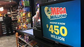 Image: A Mega Millions sign is pictured in a store in New York City