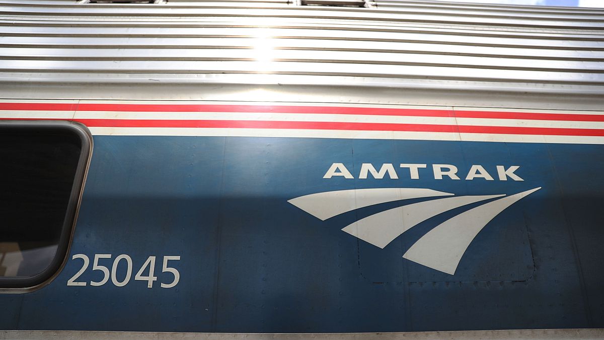 Image: An Amtrak train waits at a station