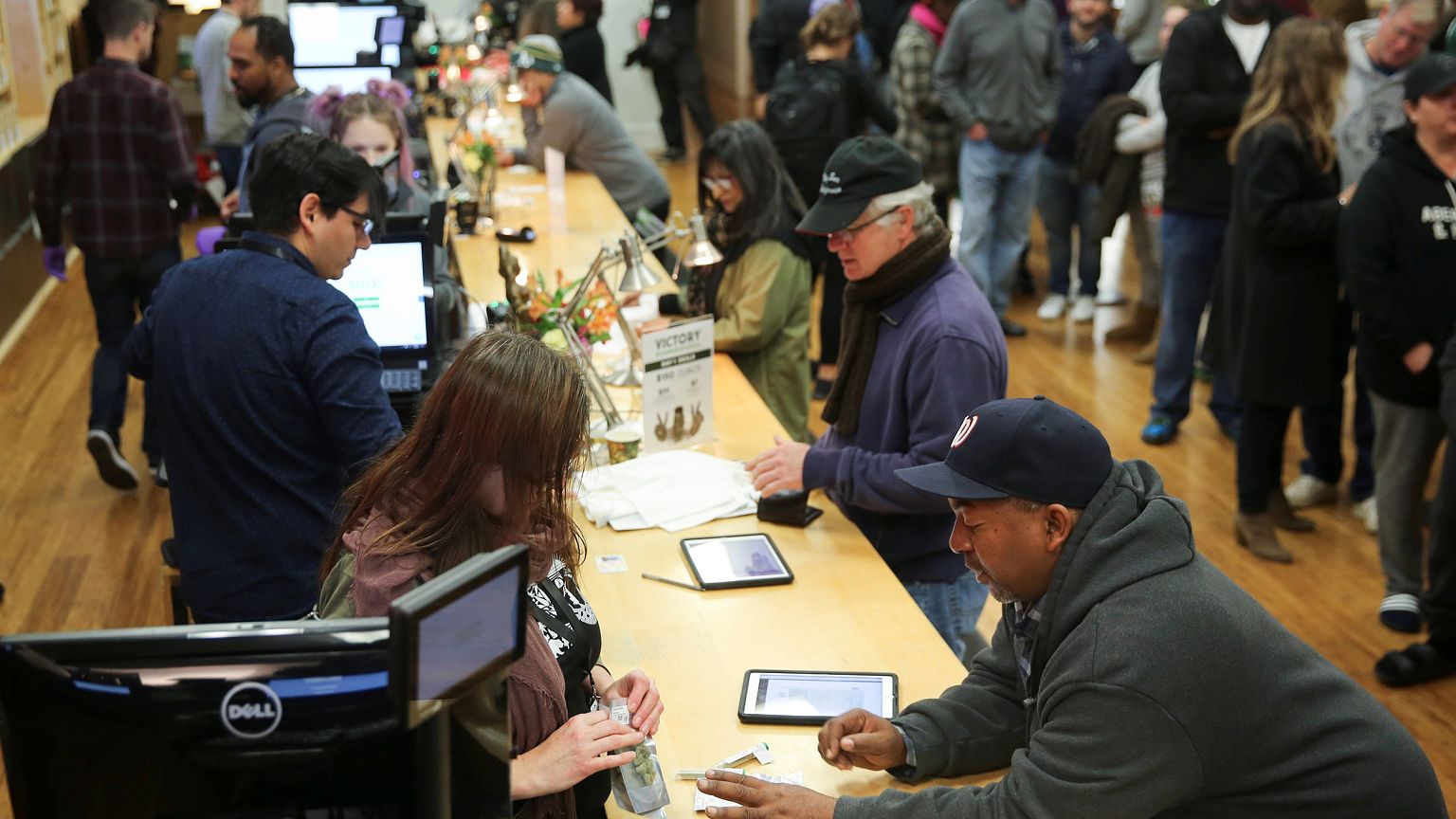 Image: Customers purchase marijuana at a dispensary in Oakland on the first