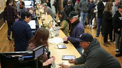 Image: Customers purchase marijuana at a dispensary in Oakland on the first