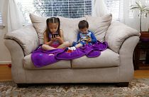 Image: Juliana Sanchez, 5, and her brother, Francisco Sanchez Jr., 2, watch