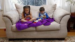 Image: Juliana Sanchez, 5, and her brother, Francisco Sanchez Jr., 2, watch