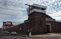 Guard towers loom over the wall of New Jersey State Prison o