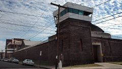 Guard towers loom over the wall of New Jersey State Prison o