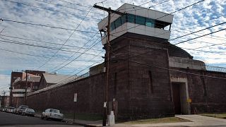 Guard towers loom over the wall of New Jersey State Prison o