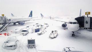 Image: Airplanes wait at the gates outside terminal five at John F. Kennedy