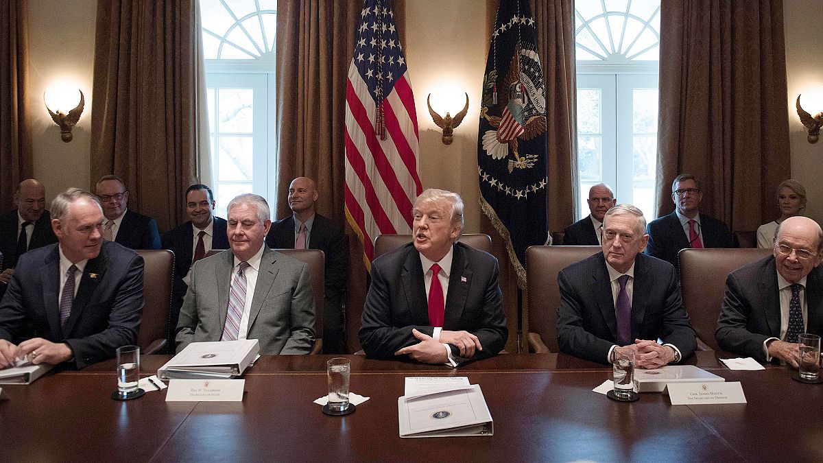 Image:  President Donald Trump, center, speaks during a cabinet meeting at 