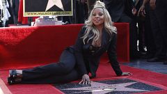 Image: Mary J. Blige sits next to her star on the Hollywood Walk of Fame