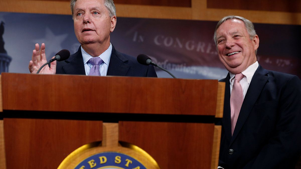 Image: Graham, with Durbin, talks about possible legislation for so-called 