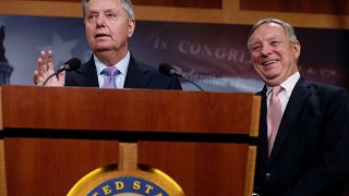 Image: Graham, with Durbin, talks about possible legislation for so-called 