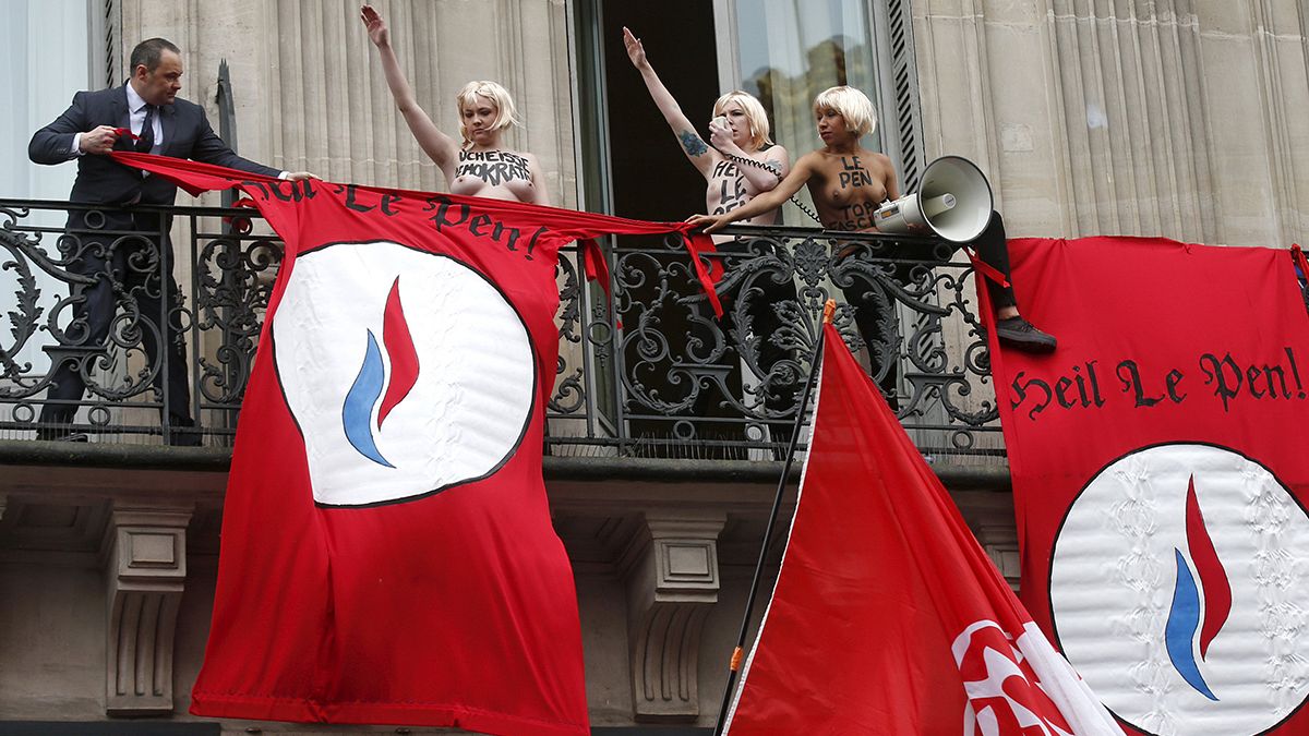 Femen protest disrupts Marine Le Pen's May Day rally