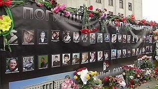 Peope in the Ukrainian port of Odessa remember victims who died during clashes a year ago