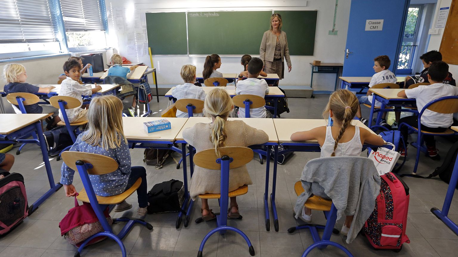 Image: Schoolchildren in a class.