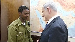 Israeli Prime Minister Benjamin Netanyahu meets with Ethiopian Israeli soldier Damas Pakada