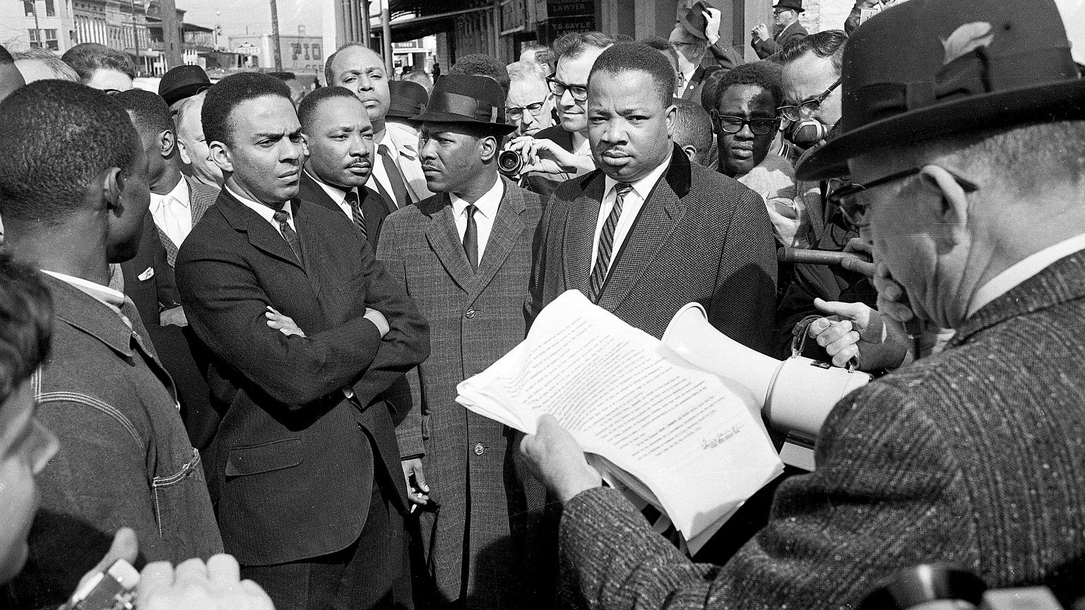 Image: A federal marshal reads a court order halting a planned voter regist