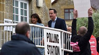 Candidates go to vote in closest British election in a generation