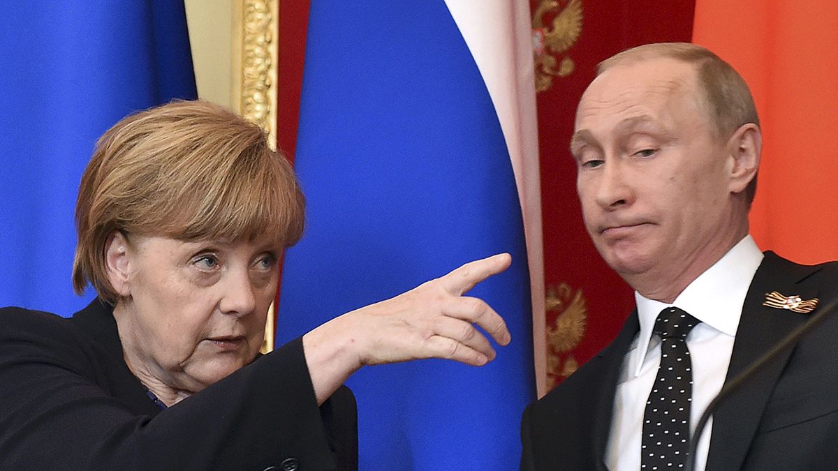Putin and Merkel agree Ukraine peace deal not being respected